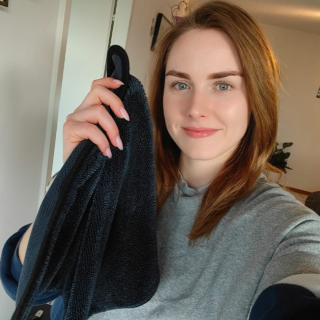 Customer holding the ClearWipe cloth